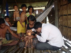 Examining-child-in-village